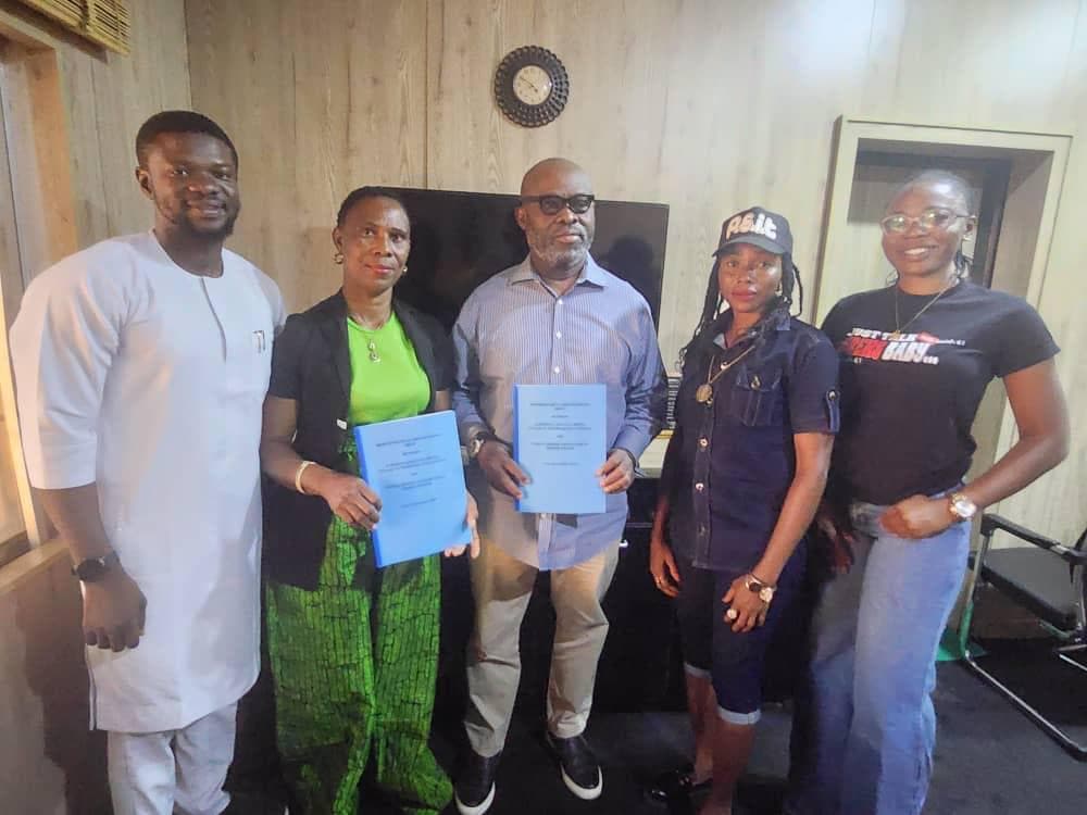 Workbridge and FEDAN representatives presenting their signed memorandum of understanding
