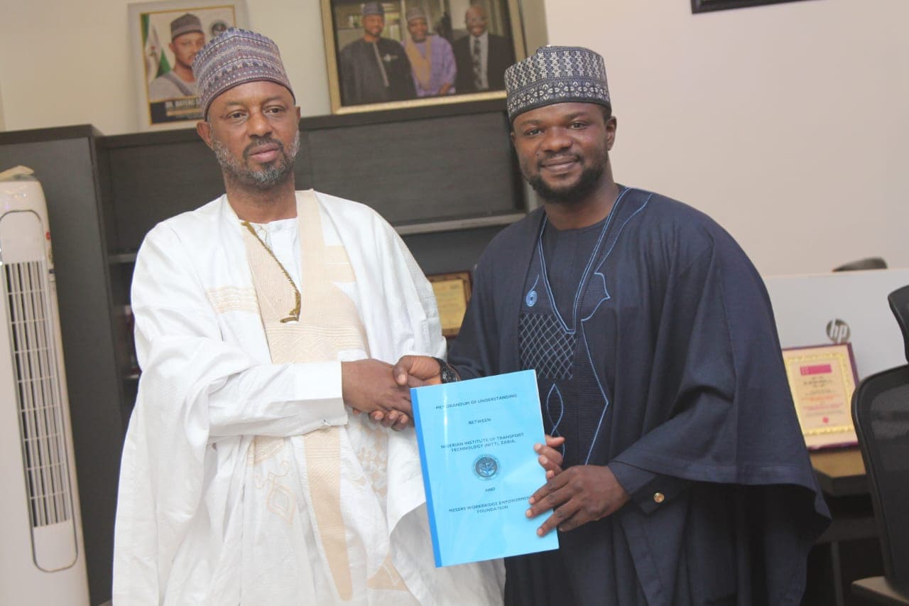 Workbridge and NITT representatives presenting the signed memorandum